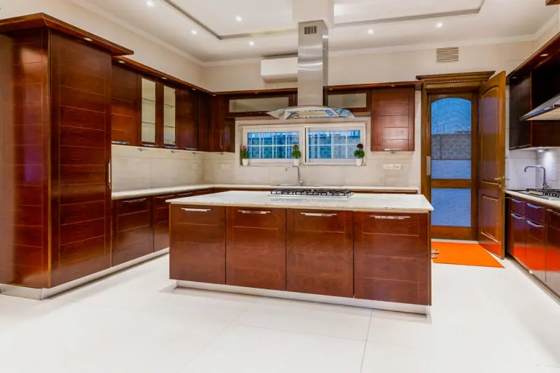 Cherry-wood kitchen remodel with white island in Findlay, OH