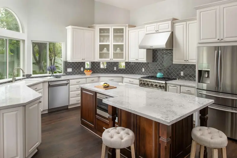 Code-compliant kitchen remodel with vented range hood and dark island in Findlay, OH