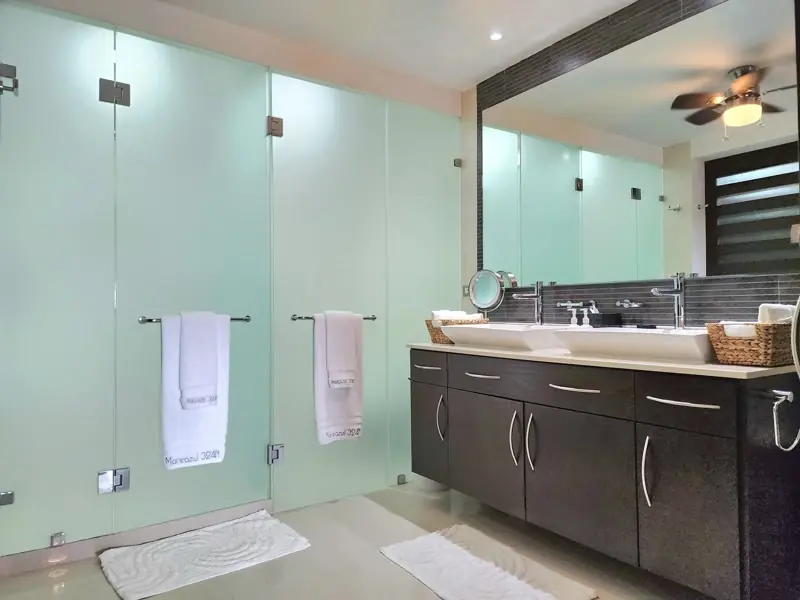 Dark-vanity bathroom remodel with waterproofed glass shower in Findlay, OH