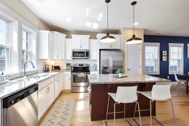 Level cabinet runs and island in a remodeled Findlay kitchen